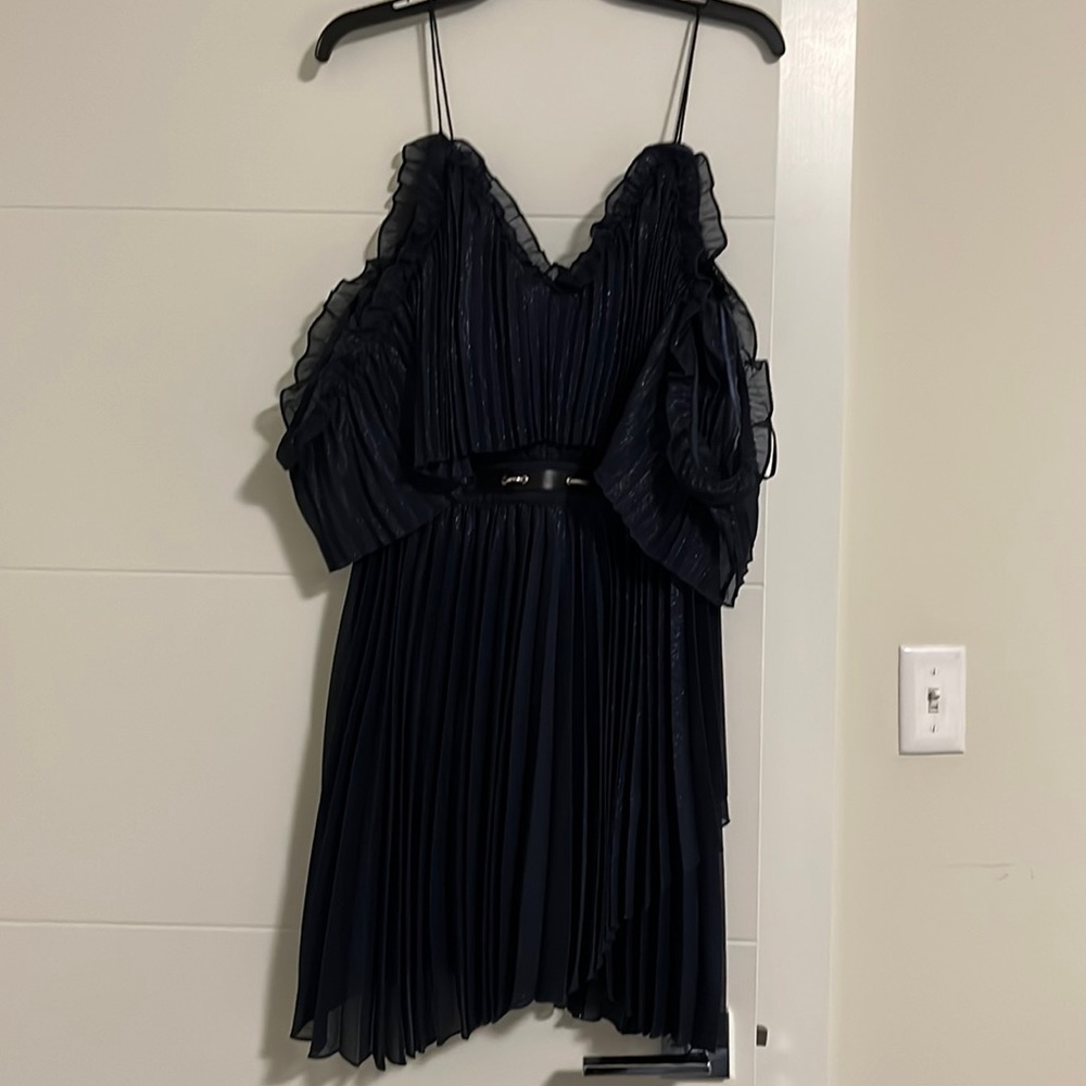 Gorgeous dark blue dress with belt detail.